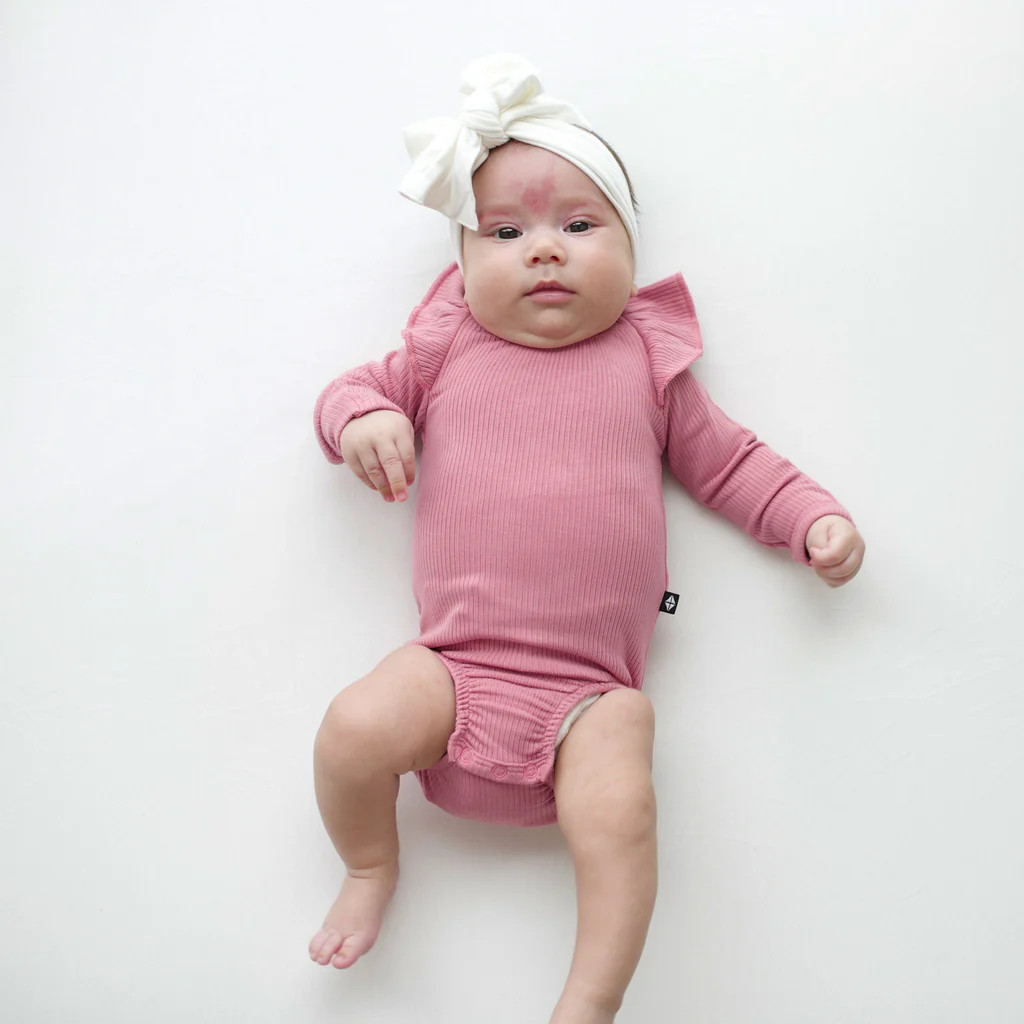 Ribbed Long Sleeve Ruffle Leotard in Apple Blossom | Kyte BABY