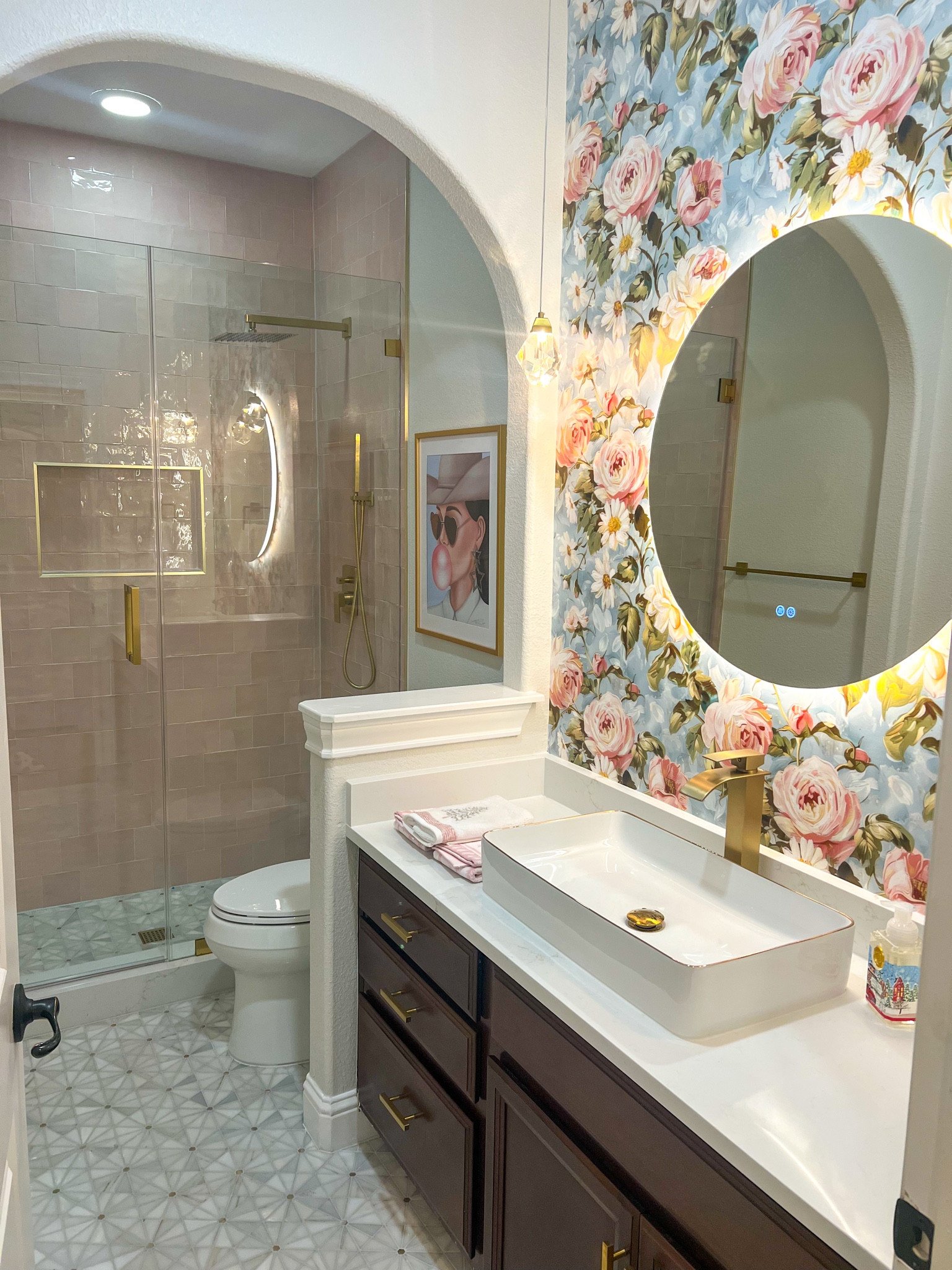 Bathroom Remodel! Linked as much as I could to the post and posted names and information below if not available on LTK:

Wall Paper: The Painted Paper: Louisa Floral (similar option linked)
Pink Tile: Arizona Tile: Flash Blush Ceramic Tile 5x5 (similar option linked)
Cowgirl Print: ReagArt Designs
Gold Schluter: Home Depot

#LTKStyleTip #LTKHome #LTKMostLoved
