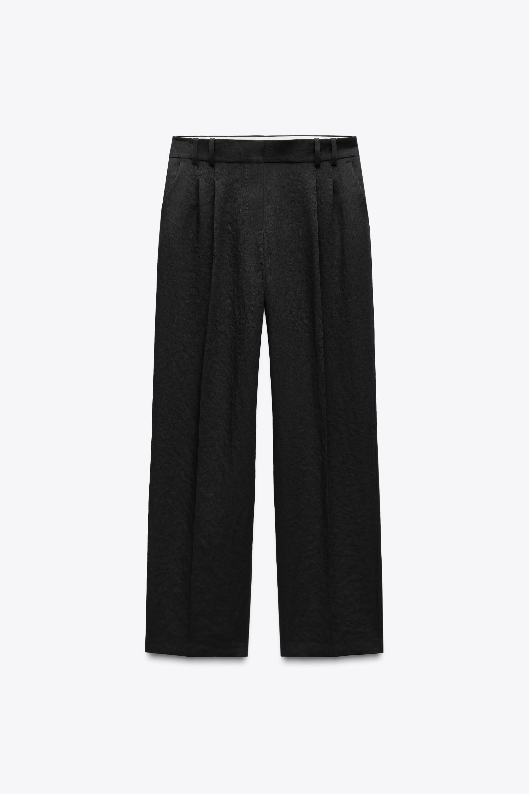 High-waist trousers with darts. Front pockets and rear welt pockets. Straight leg. Zip fly and ho... | Zara UK