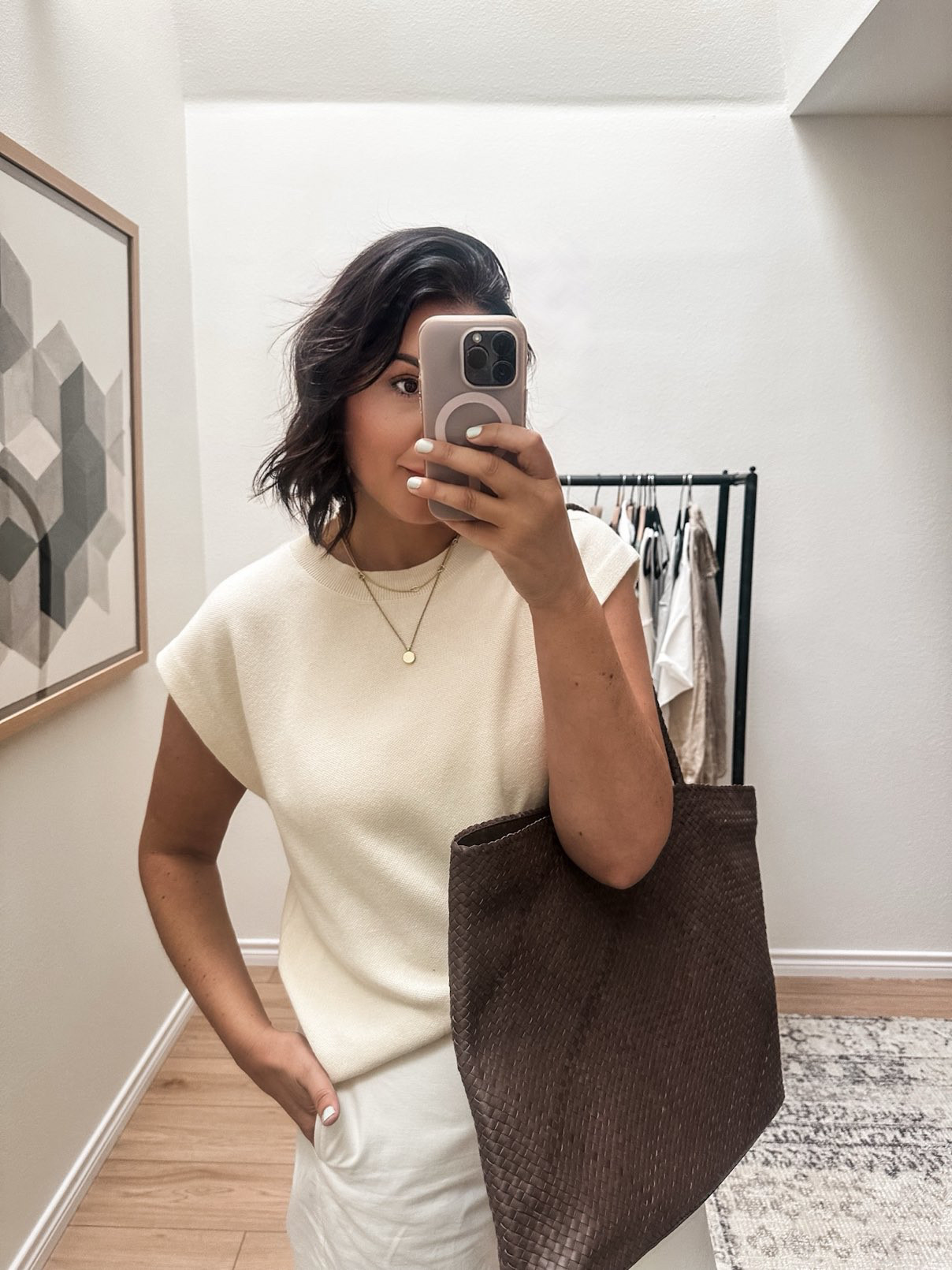 This is a top I’ve been wearing NON stop since I got it! I am in the medium, it runs TTS but if you want it to fit a bit looser like the model go up one size for boobs. 

It’s under $20, too! It’s a nice boundy knit, slightly thicker but not hot. My only issue is that if you wear a crossbody (like the Clare V one) it will pill where there is friction. I just simply took my sweater shaver to it and voila! Like new. But it is the nature of this fabric.

I'm in the medium of the skirt -- fit is TTS! From Quince.  

 