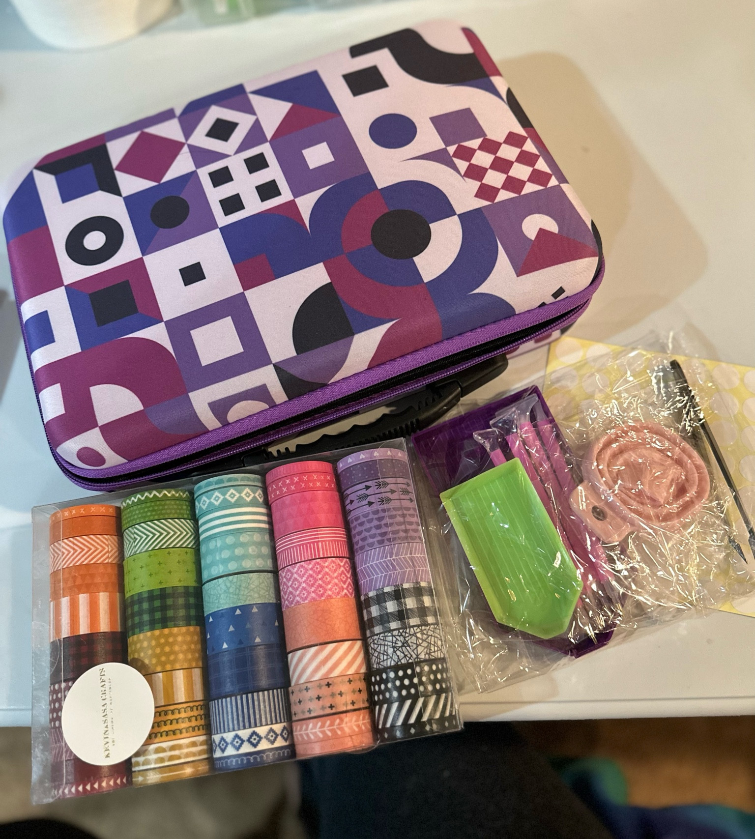 New diamond painting essentials. I got a very large custom painting from MyCraftJoy so I needed some new supplies. I got a case that hold 60 jars of drills that came with a tool kit that included a funnel, a couple trays, some wax, a few bags, and some pink pens with different tips. I also got a set of washi tape in different sizes and colors  

#LTKhome #LTKunder50 #LTKFind