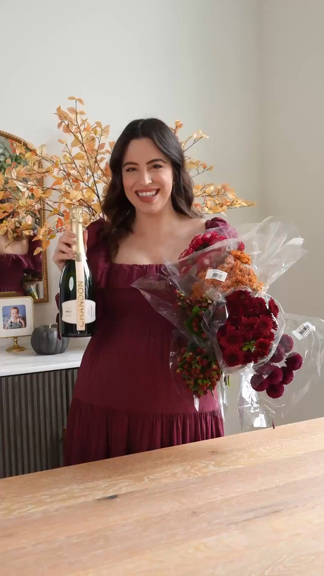 Looking for a hostess gift that feels really special and thoughtful? This floral wine bottle is it, and it's so much easier to make than it looks! Fresh flowers, floral foam, your favorite prosecco, wrap it up and you're done!

DIY flower gift, prosecco bouquet, midi dress, floral foam, cellophane wrap, Pottery Barn, thoughtful present