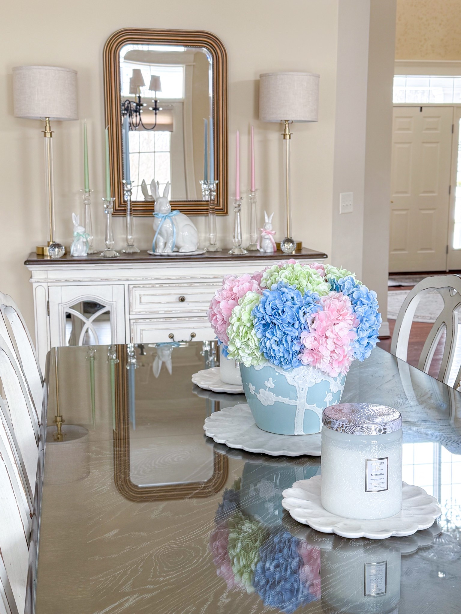 Shop my Easter centerpiece and sideboard decor! 

Blue ginger jar, faux hydrangeas, real touch hydrangeas, amazon flowers, Amazon finds, faux flowers, spring centerpiece, spring arrangement, Voluspa candles, marble tray, crystal candleholders, white bunny, buffet lamps, gold mirror, large bunny figurine, dining room inspo, kitchen inspiration 

#LTKParties #LTKHome #LTKSeasonal