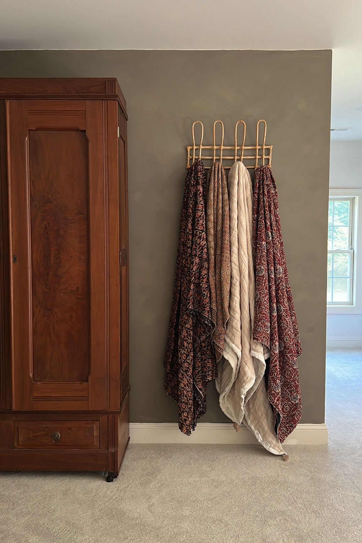 Coat rack for hanging Kantha quilts. Love displaying our blankets rather than putting into a basket. 

Vintage coat rack, French knob rack, bentwood rack, amber interiors vibe, Etsy find, Etsy home, holiday, Christmas, Target find, Amazon home, Amazon find