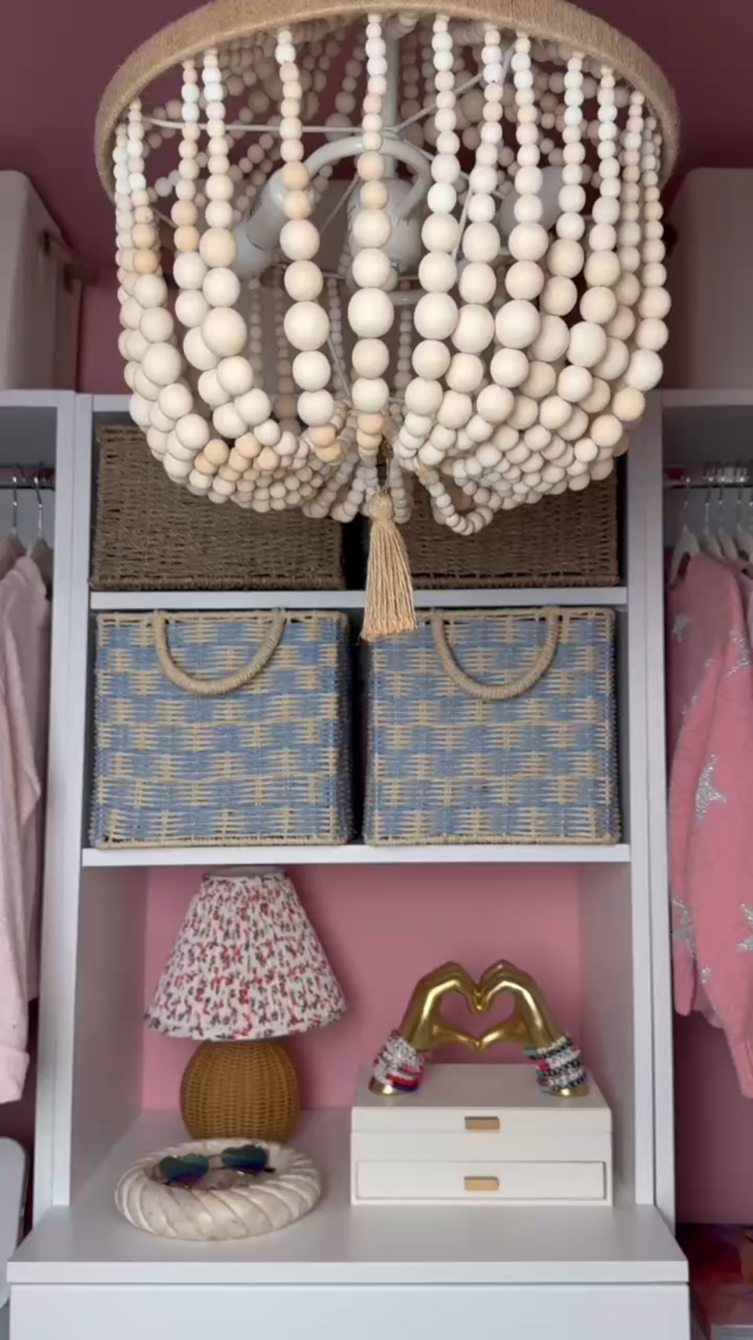 Mission Pink: activated 💖✨
This closet corner makes organizing fun with the perfect combo of woven storage baskets, a beaded chandelier, and a pop of gold with the bracelet hand display 💫 Add a soft floral lamp and you’ve got a space that’s as charming as it is functional!

Would you do a pink setup like this? 🎀👇

#MissionPink #ClosetGoals #WovenBaskets #BeadedChandelier #KidsClosetInspo #StorageSolutions #ClosetStyling #GoldAccentDecor #OrganizationInspo #eanesinteriors



#LTKstorytime #LTKHome #LTKvlog