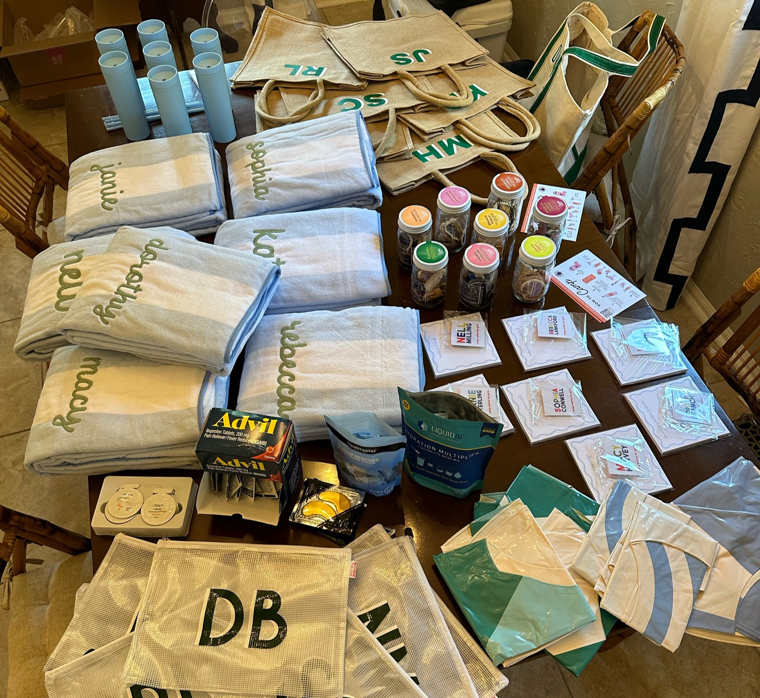 I had the best time putting together goodie bags for my bachelorette weekend!

I used jute tote bags from Sprinkled with Pink shop with my bridesmaid’s initials on the front. Inside the bag were personalized water bottles and pool bags from the brand all in coordinating colors!

Weezie Towels personalized lounge chair covers were high on my wishlist and fit the color scheme and location perfectly. 

Since the theme was Camp Walton it only felt right to include a Camp Cocktail in the tote! Everyone got a different flavor which they can fill with the liquor of their choice to enjoy over the weekend or when they get home. 

Joy Creative Shop is my go-to for personalized paper goods and their camp themed luggage rages were adorable to put on each bag. I also included their scallop notepad in the bag!

It’s not a trip to a body of water without some sort of float and I found three different styles of pool rings that matched our color scheme. I got one for each girl and we ended up using them as decoration on the porch where we had dinner Friday night before putting them in the water. 

As for essentials, I put travel size items that may be handy over the weekend inside each of the zippered personalized pool bags. I included liquid IV, advil, makeup wipes, sunscreen, aloe, lip balm, and eye patches!

My maid and matron of honor handled “branded” items to match the theme and got camp mugs, baseball hats, and hand stitched personalized bandanas that were such a cute touch. 

While bachelorette weekend gifts definitely aren’t a requirement, I knew I wanted to do something special for my friends as a thank you for being in my wedding and coming to my bachelorette weekend! 

#LTKparties #LTKwedding #LTKunder100