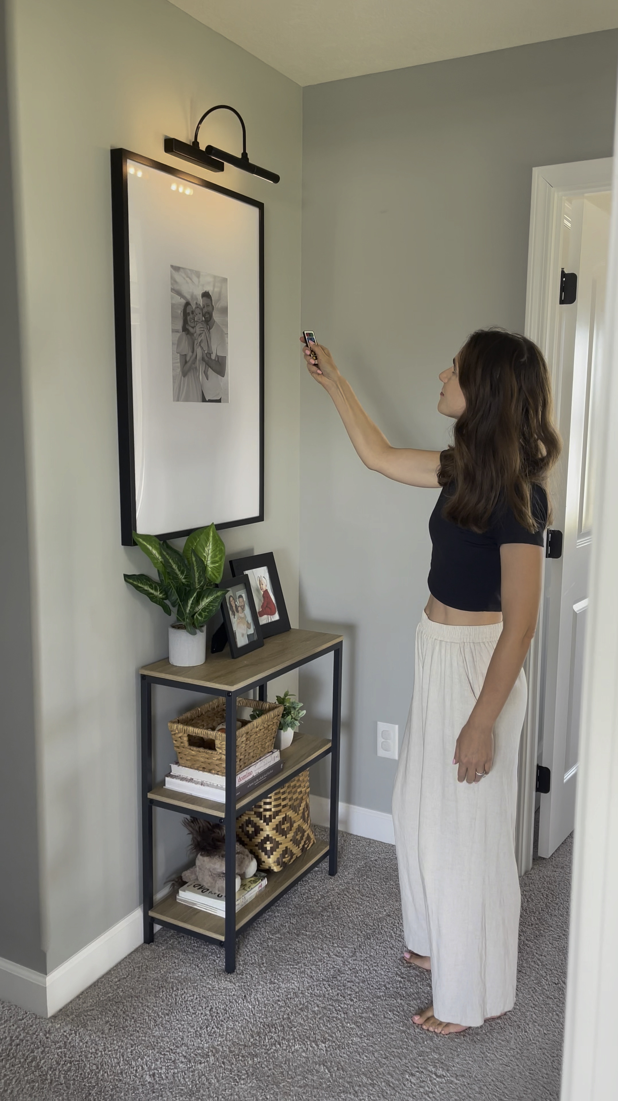 Battery operated wireless art light with remote control. Choose from warm or cool light at full or 1/2 strength. You can also set a timer. Great option to easily add charm to your home and feature a favorite piece of art or photo. Light fixture also comes in different finishes. 

#LTKHome #LTKFindsUnder50