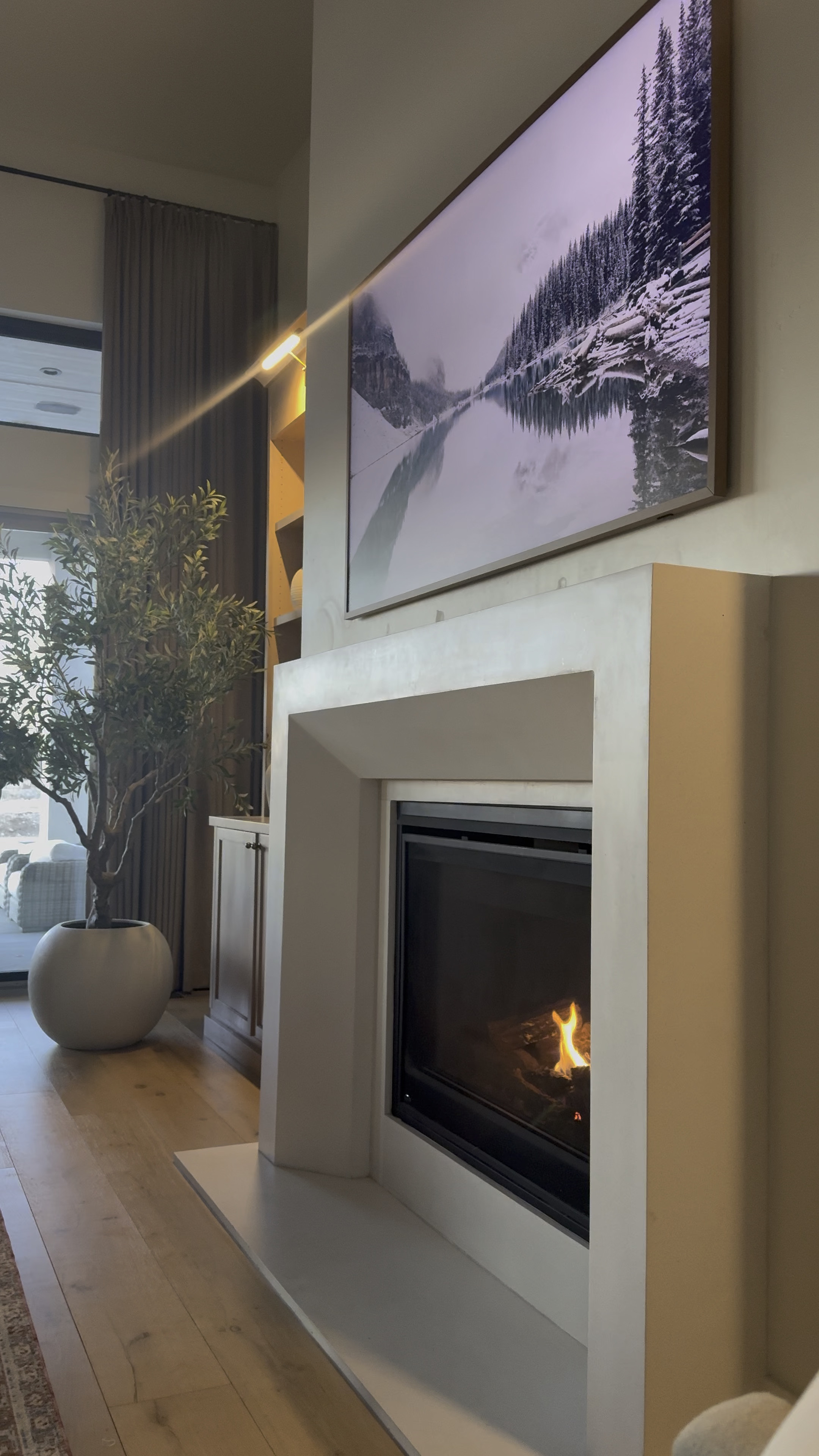 Just spending some quiet time by the fire before kids wake up for the day and admiring my olive tree that will forever be a favorite and this whole living room moment . 

#LTKStyleTip #LTKHome #LTKSaleAlert