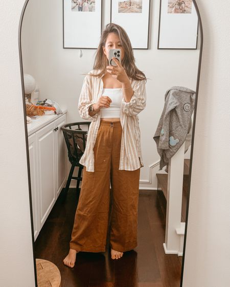 spring transitional where it’s almost hot enough to pair this top with shorts but not quite. 

Love these wide leg viral pants from madewell. Wearing size 6 petite but I probably would need standard to pair with heels.
Top is target in a M for oversized fit. 
bra is S  

#LTKFestival #LTKSeasonal #LTKxTarget