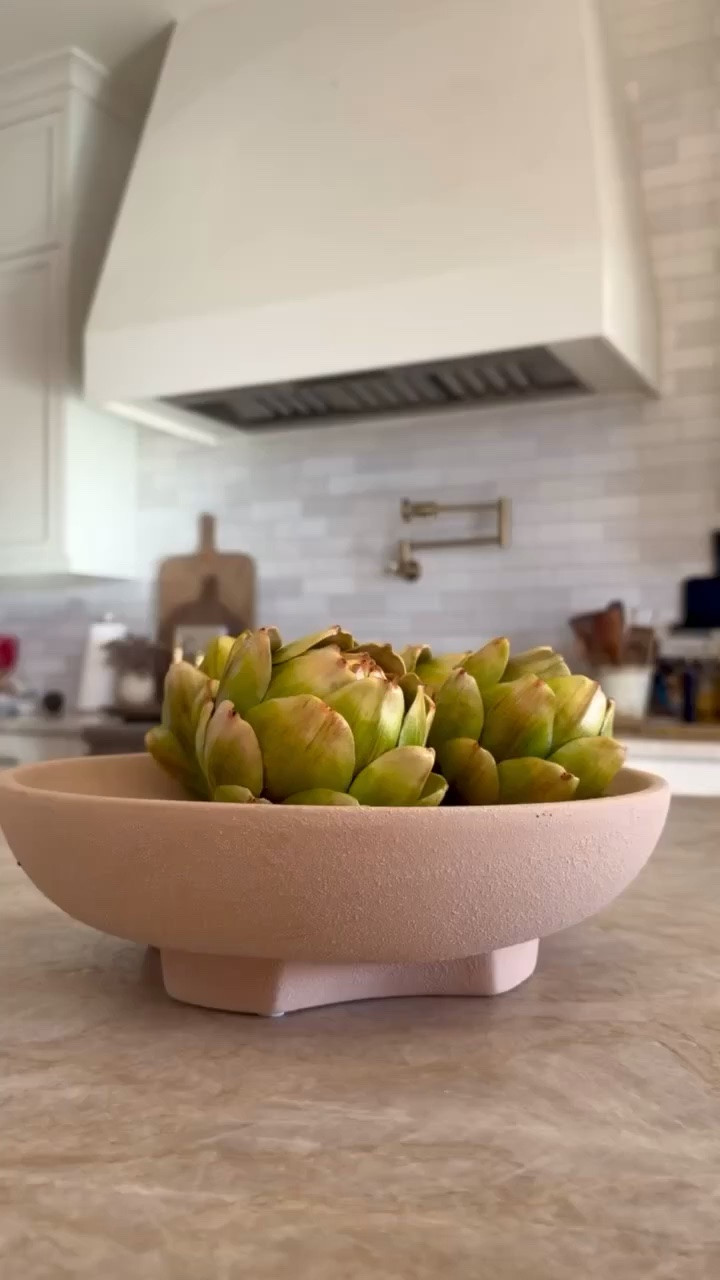 I’m linking the ceramic pedestal bowl and the faux artichokes I used here because this combination is one of my favorite easy kitchen styling tricks. The bowl has a soft stone texture and neutral taupe tone that works beautifully on a kitchen island, counter, or coffee table.

I filled it with these realistic faux artichokes to create a simple organic centerpiece that adds color and texture without feeling busy. It’s an easy way I like to bring a natural, collected look into the kitchen while keeping the styling calm and minimal.
@Walmart
@Amazon

#LTKU #LTKHome #LTKSaleAlert