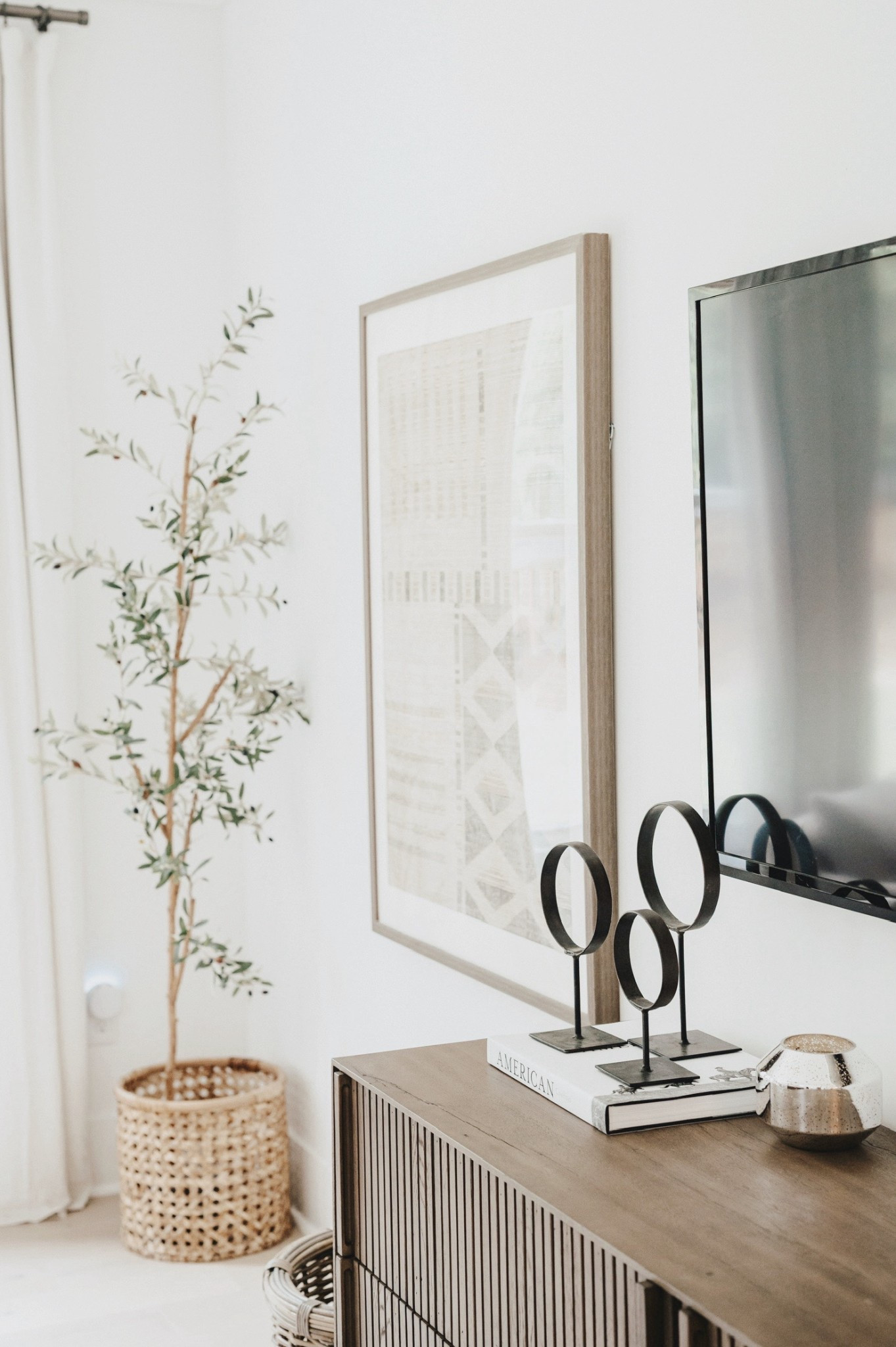 Earthy modern classic master primary bedroom space with wooden dresser, framed tapestries and faux olive tree ✨

#LTKHome #LTKStyleTip