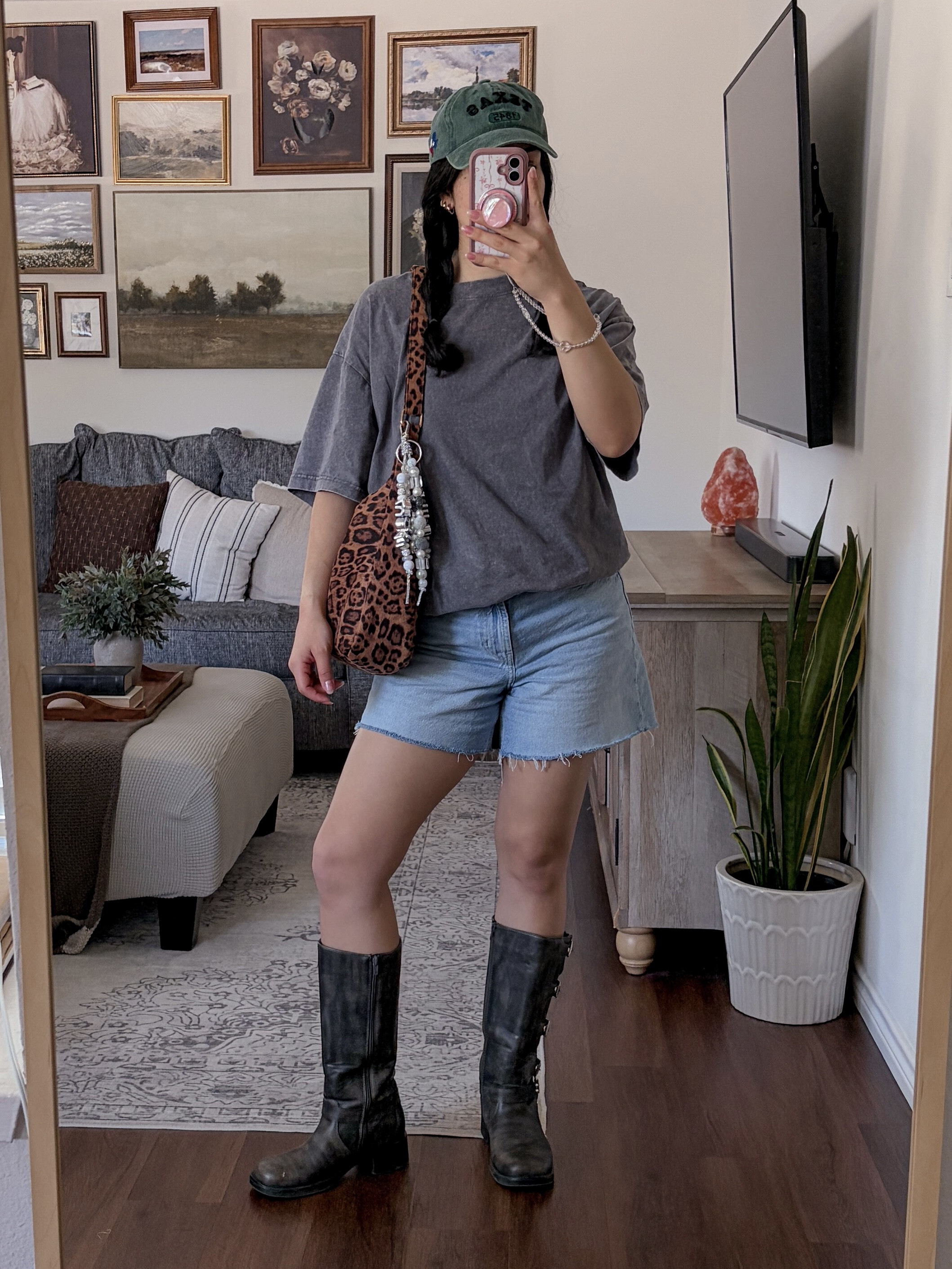 outfit of the day from today's vlog on youtube! moto boots outfit, oversized tshirt outfit, mens tshirt outfit, cut off denim shorts outfit, denim shorts outfit, baseball cap outfit, leopard bag outfit, casual cool outfit, edgy casual style, street style outfit, model off duty look, effortless outfit inspo, cool girl outfit, casual chic outfit, everyday outfit inspo, laid back style, edgy streetwear, comfy cute outfit, boots and shorts outfit, oversized tee and boots, western edge outfit, neutral outfit inspo, casual summer outfit, off duty aesthetic, sporty chic outfit, trendy casual look, ootd, outfit inspo, style inspo, fashion inspo 2026, everyday style, leopard print accessories, statement bag outfit  

 #LTKdayinmylife #LTKgrwm #LTKootd