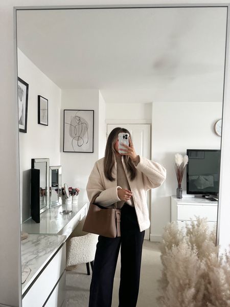 Neutral winter outfit, cream bomber jacket, tan over sized jumper, black wide leg trousers, adidas sambas. 

#LTKeurope #LTKstyletip #LTKSeasonal