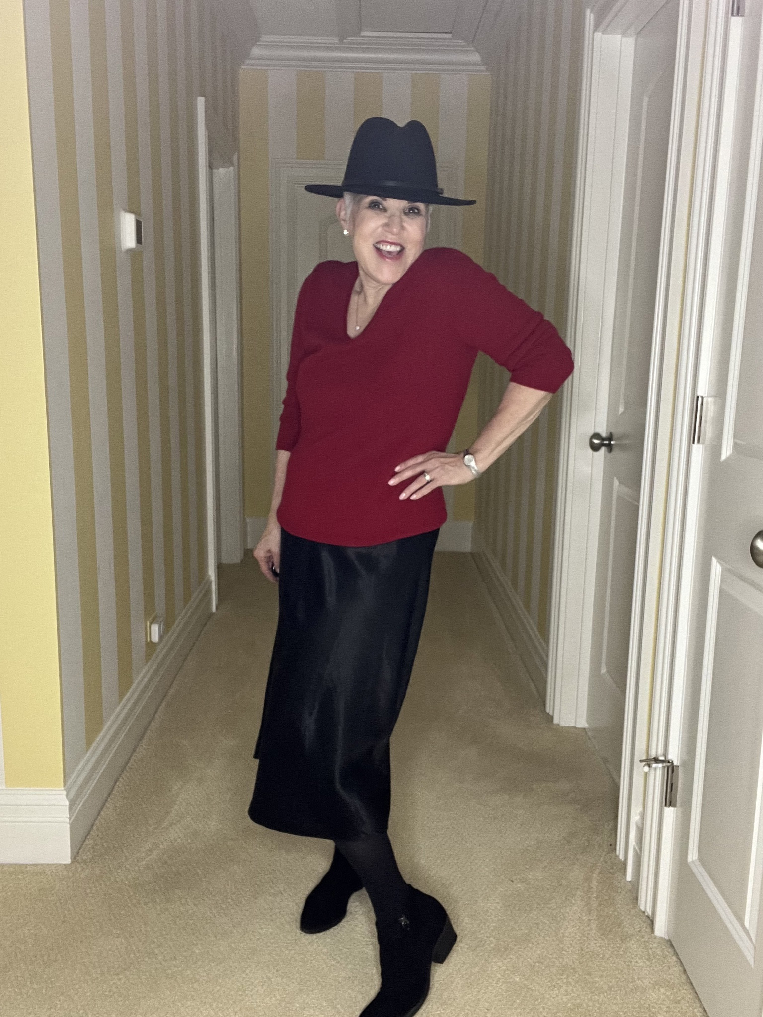 Great @vince slip dress (low stock so I also linked a great option ⬇️) (s).  Worn with a black hat, red cashmere sweater (on sale), black booties and tights.#ltksalealert
#ltkstyletip
#ltkwinterfashion
#ltkworkwear#LTKMostLoved

#LTKover40 #LTKSeasonal