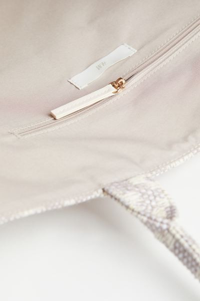 Handbag in a jacquard-weave cotton blend with two handles. Inner compartment with zipper. Lining ... | H&M (US + CA)
