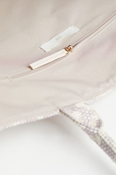 Handbag in a jacquard-weave cotton blend with two handles. Inner compartment with zipper. Lining ... | H&M (US + CA)