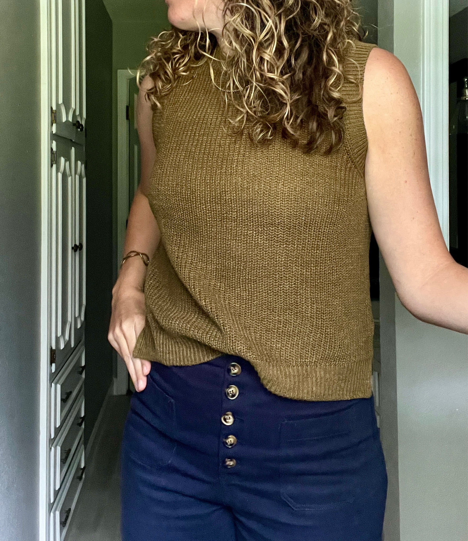 I love this sweater tank. Size down one size. I’m typically a small or medium and I’m wearing a XS in this. I’m 5’8” for reference. 

Button pants were bought in Spain but I added a few similar options below. 

Brass bangle was a vintage find at a thrift store. 

#LTKWorkwear #LTKSeasonal #LTKStyleTip