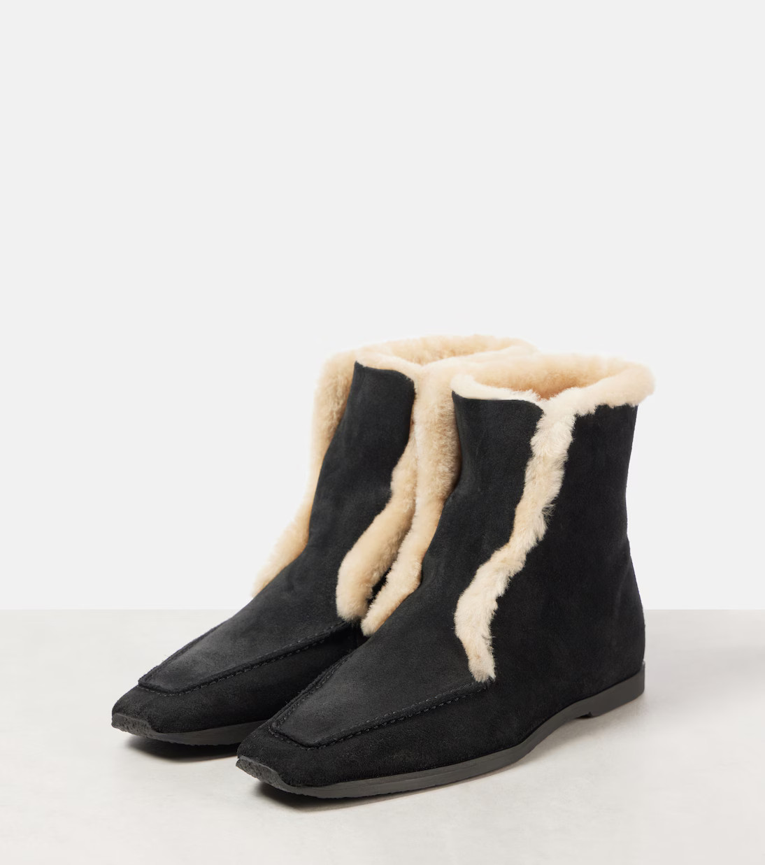Shearling-lined leather ankle boots | Mytheresa (US/CA)