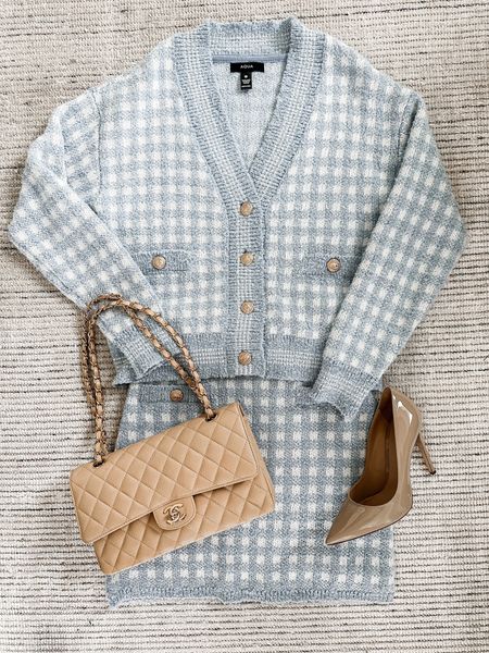 Winter outfit transitioning to Spring look with blue checkered knit skirt and sweater cardigan. Can be purchased to create a set or individual pieces to style with other items! So soft and such a pretty look. Skirt is on sale for 40% off! Paired with nude pumps and nude purse. 

#LTKsalealert #LTKstyletip #LTKSeasonal