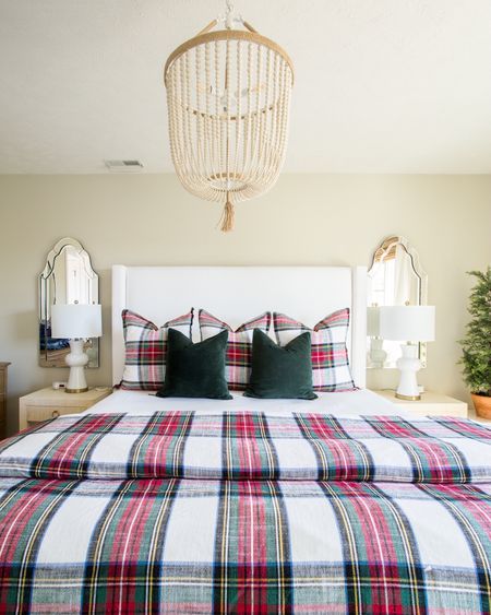 Our guest bedroom is all decorated for Christmas! Decor includes a Pottery Barn Stewart plaid duvet with shams, green velvet pillows, an upholstered bed, a wood beaded chandelier, raffia nightstands, ceramic table lamps and frameless mirrors.

coastal christmas, pb inspired, holiday decor, christmas decor, christmas bedroom, serena and lily, christmas pillows, amazon christmas, amazon finds, amazon home, christmas pillows, bedroom bedding, serena and lily bedding, pottery barn bed, pottery barn curtains

#LTKunder50 #LTKunder100 #LTKstyletip

#LTKSeasonal #LTKHoliday #LTKhome