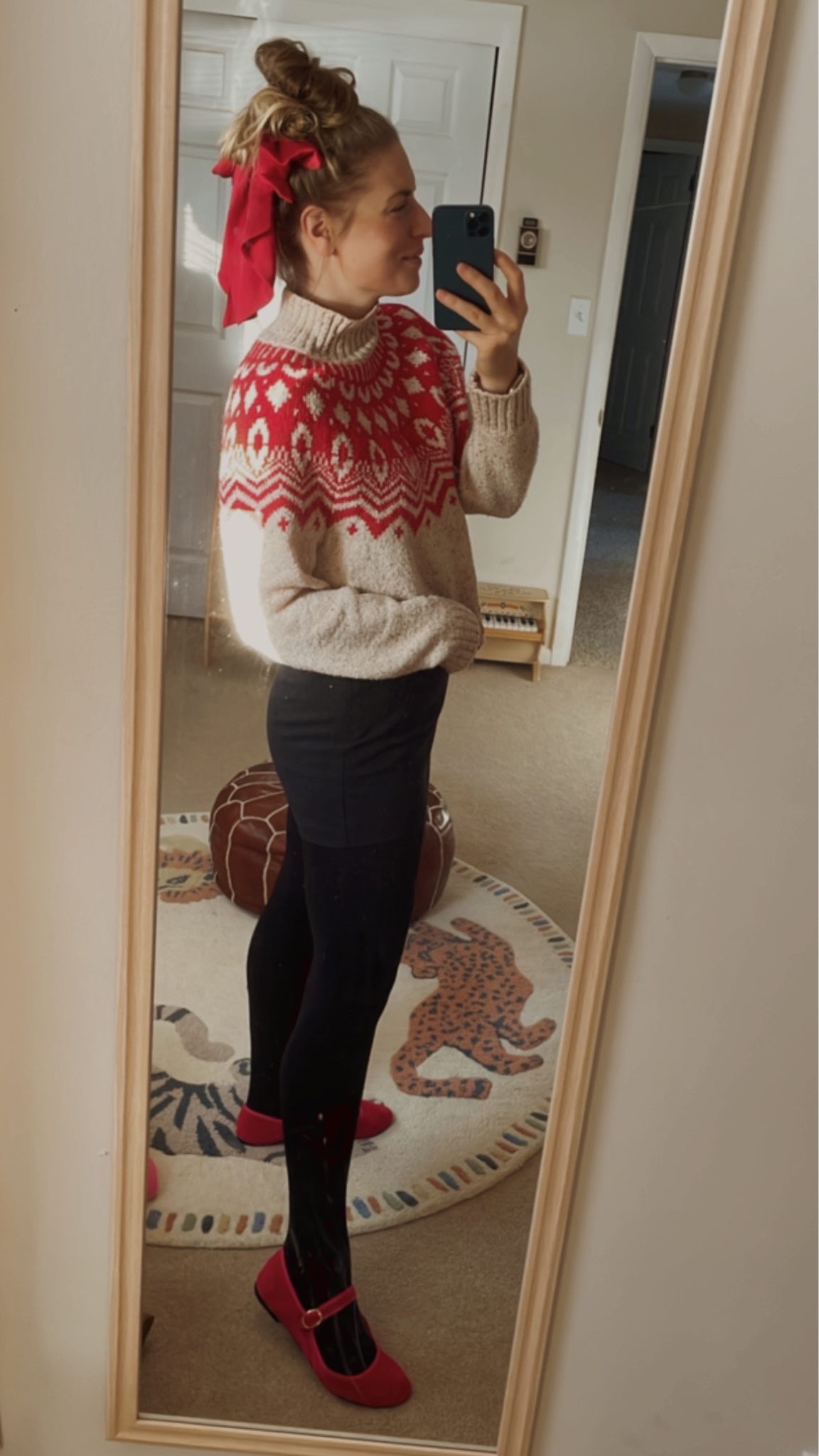 Holiday WFH ‘fit 🎀 Never met a fair isle sweater I didn’t love ❤️ This black skort fits TTS and is a closet staple. 

Christmas sweater, slippers, hair bow, Christmas ootd, holiday outfit 

#LTKworkwear #LTKSeasonal #LTKHoliday