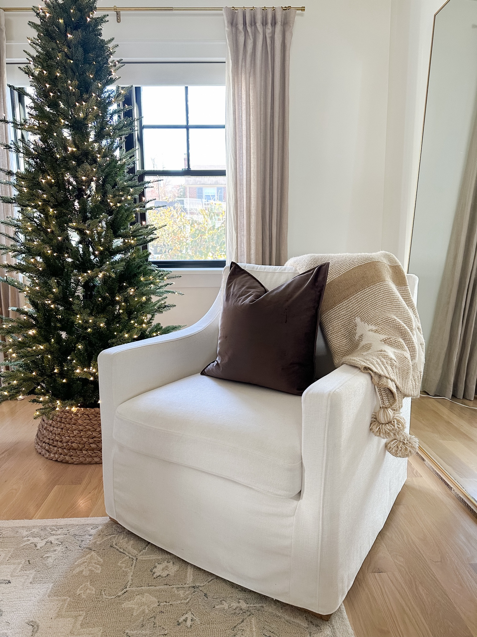 White soap, arm, slipcover chair, neutral, Christmas throw blanket. Chocolate brown velvet pillow cover from Amazon.

#LTKSeasonal #LTKhome #LTKHoliday