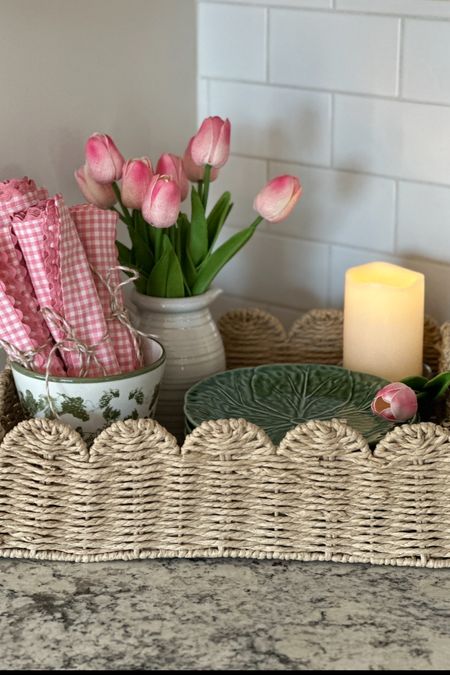 Pretty scalloped woven tray decorated for spring!  Tulips, gingham napkins and cabbage ware plates.

#ltkscallopeddecor #ltkspring

#LTKhome #LTKSeasonal #LTKstyletip