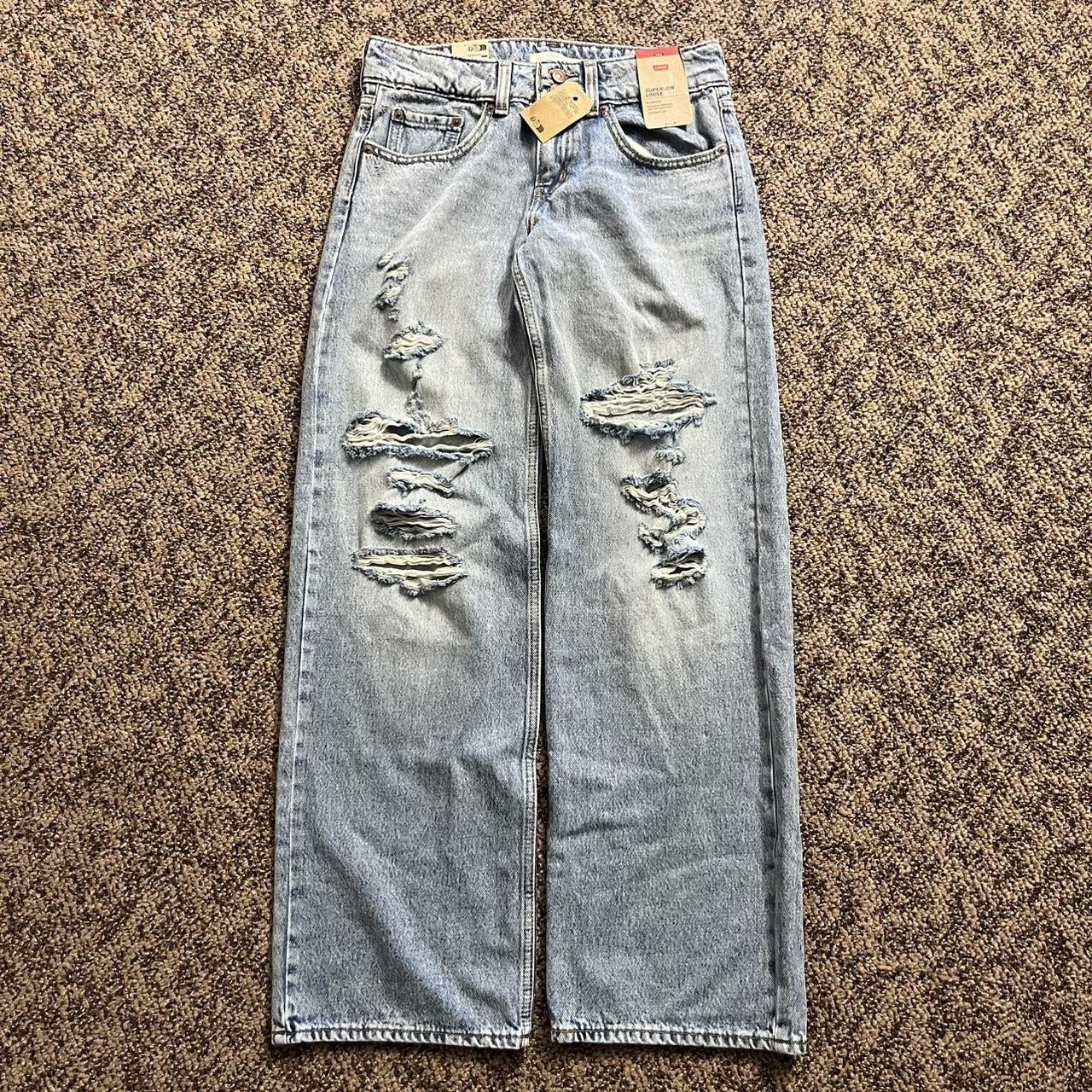 Levi's Women's Low rise Distressed Jeans - Blue - 27 | Depop US
