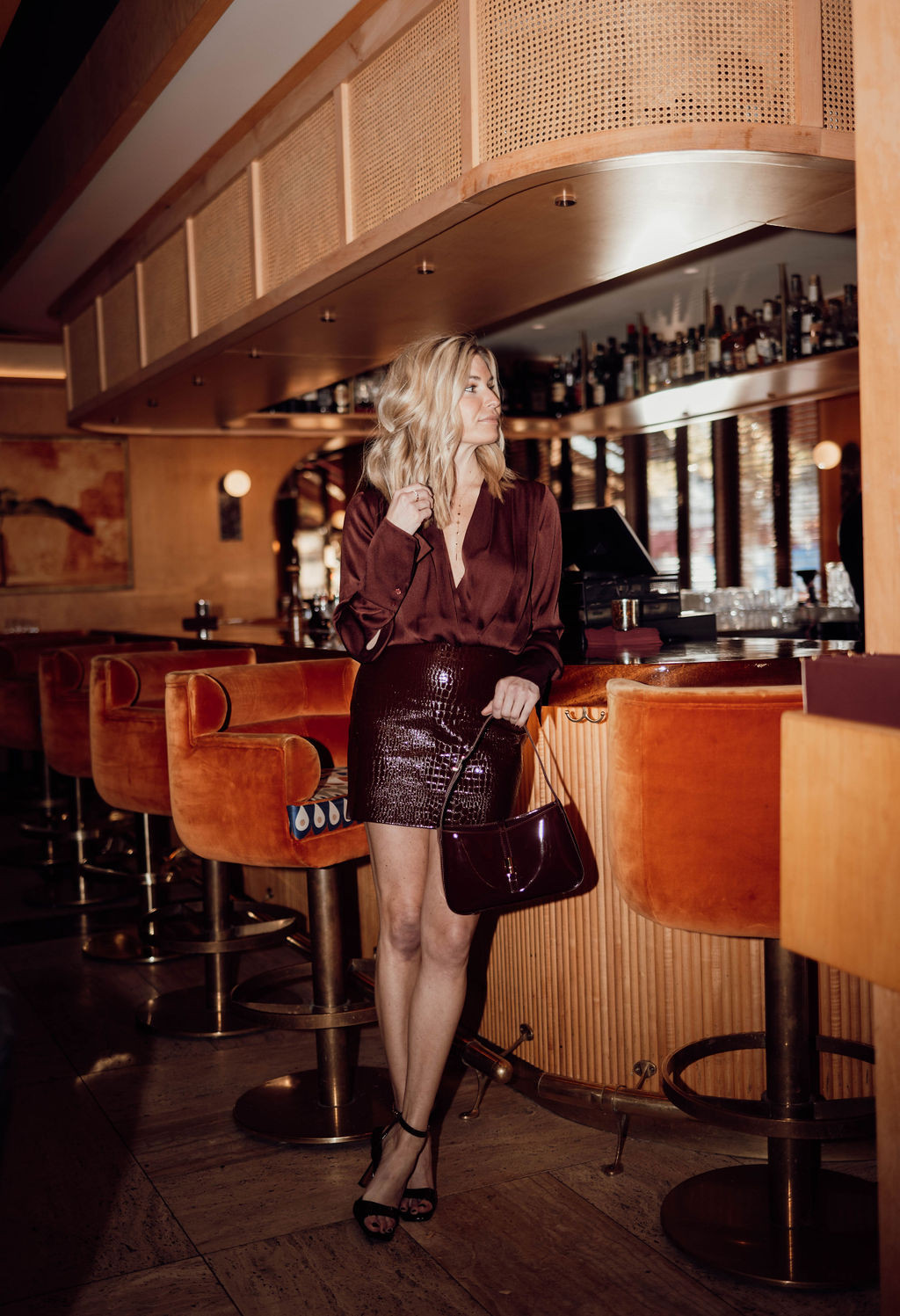 Burgundy on burgundy on burgundy — satin wrap blouse, croc-embossed mini, and the bag that ties it all together. This is the date night formula I keep coming back to: rich texture, one tonal palette, heels that let the legs do the work. 

 #LTKgrwm #LTKSeasonal #LTKWorkwear