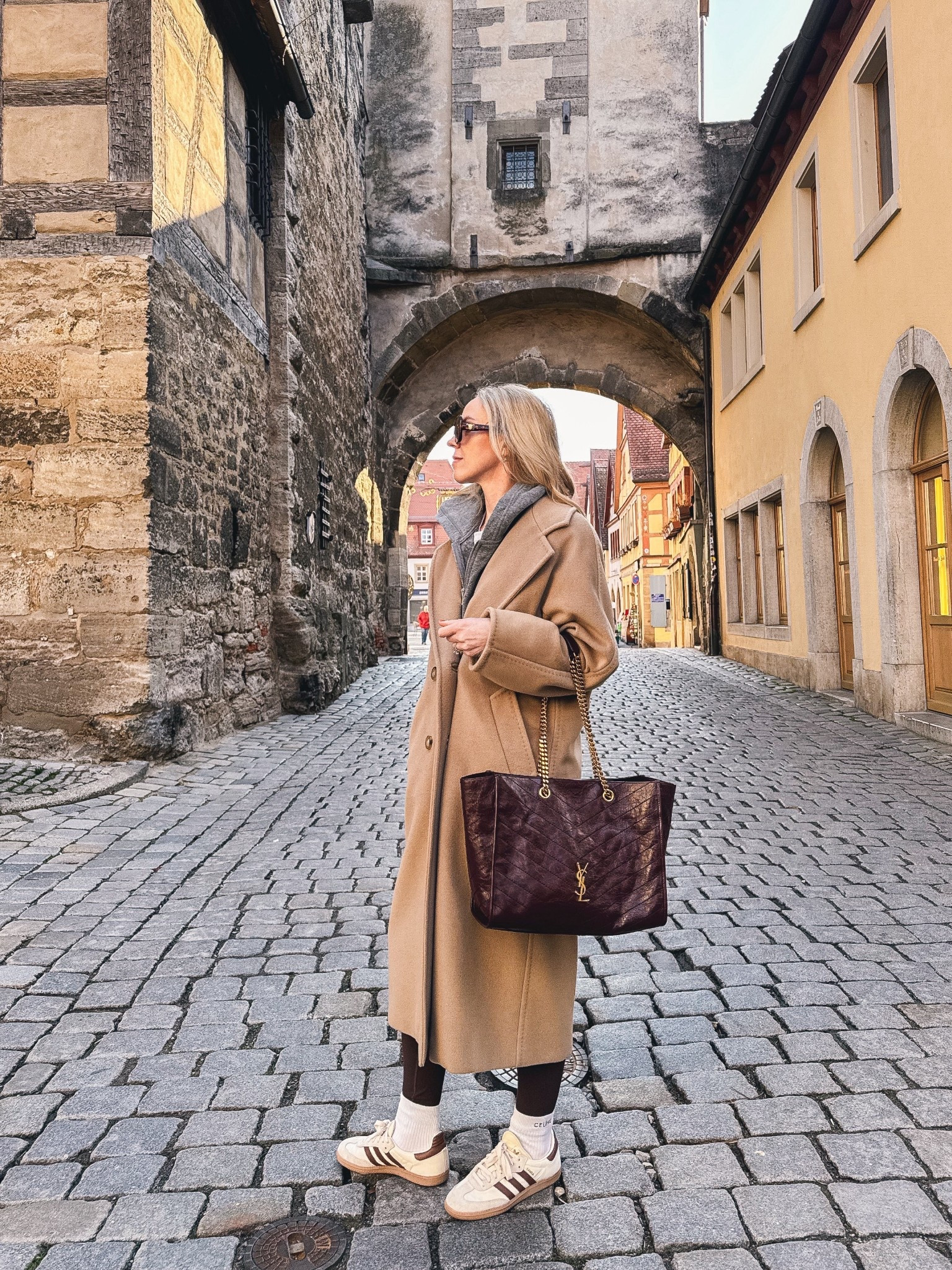 Spring travel look, camel coat, casual chic airport style, burgundy YSL tote bag 

#LTKOver40 #LTKSeasonal #LTKTravel