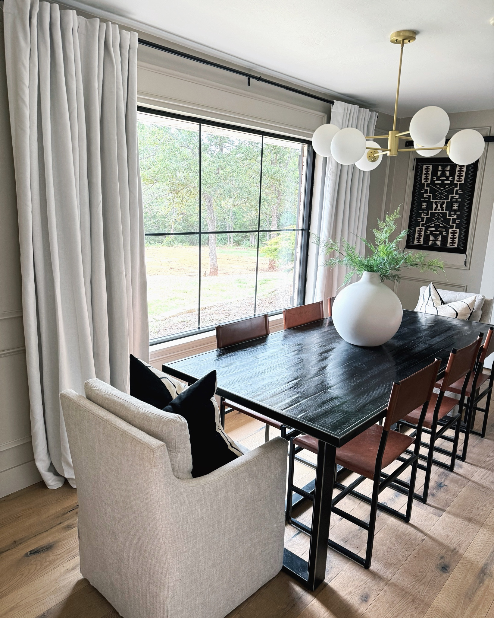 If you need nice quality blackout curtains that don’t break the bank, then get these! They look/feel expensive and hang perfectly. The exact color is Sour Cream in the 95” length (my ceiling are 8’ tall). I used a total of 4 panels for this space  

#LTKFamily #LTKHome #LTKFindsUnder50