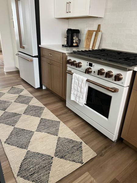Love my new loloi rug! This is the perfect kitchen runner rug- been dying to try a checkered rug somewhere in my space and the kitchen just felt right! It looks perfect next to my cafe appliances too! 

#LTKhome #LTKstyletip