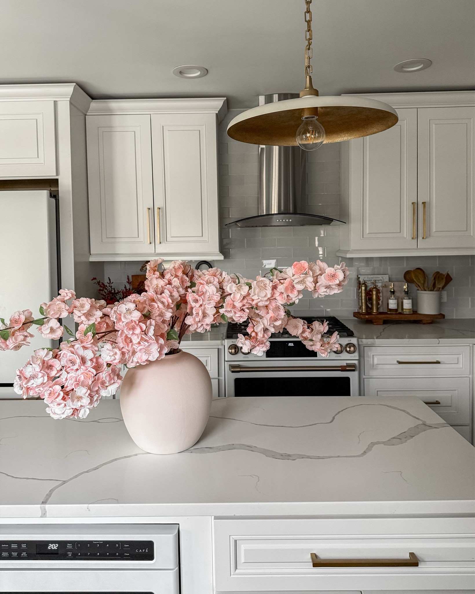 The most gorgeous Cherry Blossom stems from afloral are going to be the PERFECT spring addition in our home 😍 afloral is my go-to for all faux and dried florals, greenery, and even vases/vessels!! These are super elegant, full, and the stems are easy to manipulate to create the prettiest arrangement in any vase!! I have 4 branches in this vase! 

#LTKHome #LTKStyleTip