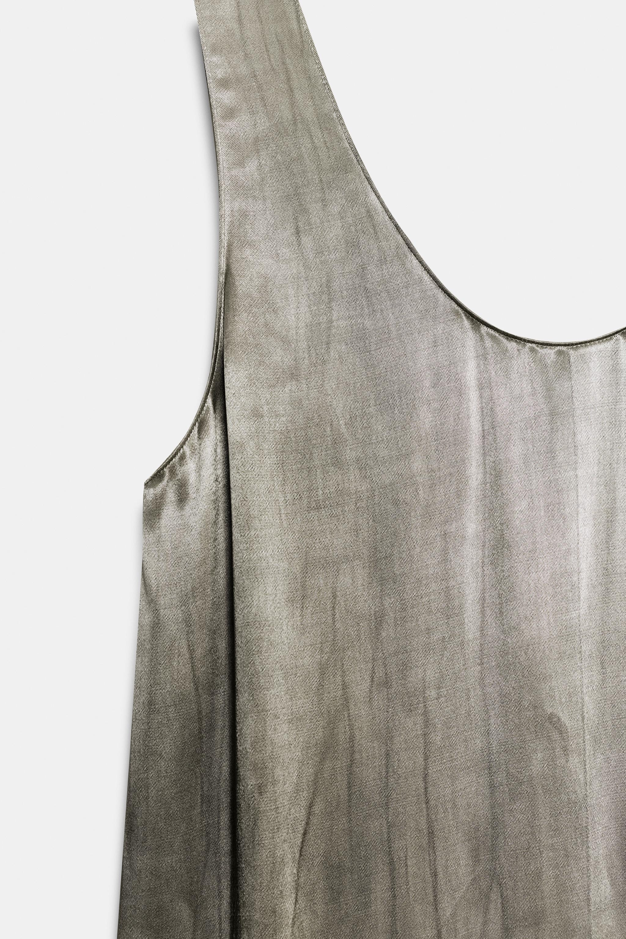 ZARA WOMAN COLLECTION. Dress made with a viscose-blend fabric. Round neckline and sleeveless desi... | Zara US