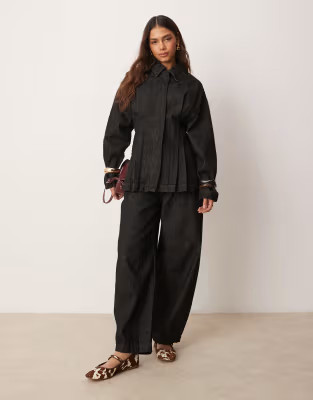 ASOS DESIGN arch leg trousers in black | ASOS | ASOS (Global)