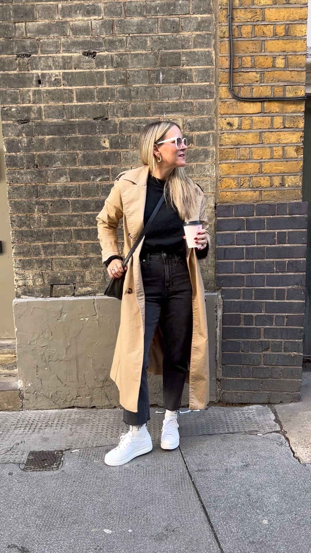I could live in this black knit sweater and these faded black wash mom jeans. I went for some contrast by adding bright white leather sneakers, white sunglasses and a classic trench coat. Could this be my fall/winter uniform, quite possibly. 

#LTKeurope #LTKstyletip #LTKSeasonal