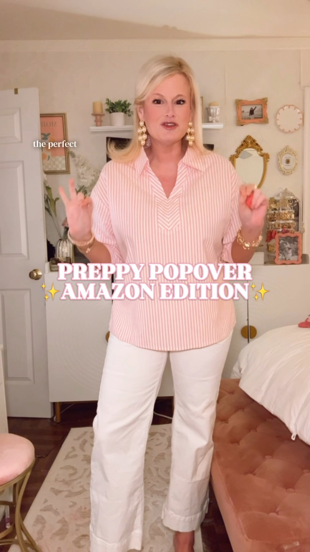 Amazon striped popover shirt, teacher outfit, work outfit women

This Amazon striped popover is such a good teacher outfit and work outfit find because it gives that crisp, preppy button-down look on a budget. 

I’m in a medium and it fits true to size. The shape is relaxed and easy, with a collared v-neck popover neckline, pink and white vertical stripes, 3/4 sleeves, wide rolled cuffs, button detail, and that polished-but-comfortable fit that works for real life.

The fabric is a 70% cotton and 30% polyester blend, so it feels lightweight and breathable. It has that casual office blouse look women search for when they want something easy with white jeans, work pants, trousers, denim, skirts, shorts, or linen pants.

This is a good one for teacher outfits, classroom outfits, school outfits, casual Friday outfits, business casual outfits, office outfits, work from home outfits, brunch outfits, travel outfits, spring work outfits, summer work outfits, and coastal casual outfits.

The pink stripe makes it feminine and preppy, but the popover silhouette keeps it easy. It is one of those Amazon tops that looks styled with almost no effort, especially with white denim, gold earrings, sandals, flats, loafers, or simple sneakers.

If you’re searching for Amazon striped shirt, pink striped shirt women, striped popover shirt, preppy popover top, collared shirt women, v neck blouse women, cotton blend blouse, teacher outfit, teacher tops, teacher style, classroom outfit, work outfit women, business casual top, office blouse women, spring work outfit, summer work outfit, casual office outfit, white jeans outfit, preppy summer top, coastal outfit women, Amazon blouse, Amazon fashion finds, Amazon workwear, or affordable preppy tops, this one is a great find.

#LTKFindsUnder50 #AmazonFinds #AmazonFashion #TeacherOutfit #WorkOutfit #BusinessCasual #PreppyStyle #StripedShirt #OfficeOutfit #SpringOutfit

#LTKWorkwear #LTKSeasonal #LTKSaleAlert