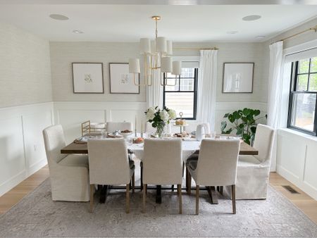 Classic and neutral dining room design, dining room furniture, upholstered parsons chairs with slipcovered end chairs, glass chandelier, gallery frames with floral printable art, gray washable Ruggable rug 

#LTKhome #LTKstyletip #LTKsalealert