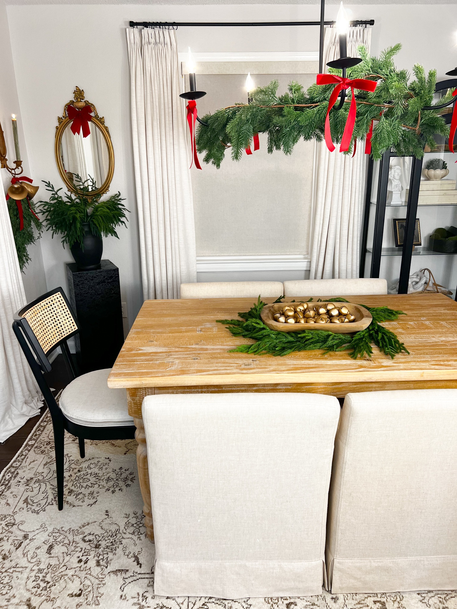 Christmas garland, chandelier, dining furniture 

#LTKhome #LTKsalealert #LTKHoliday