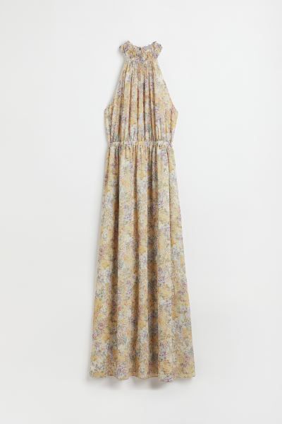 Long, sleeveless chiffon dress with narrow cut upper section. Halterneck, ruffle-trimmed stand-up... | H&M (US + CA)