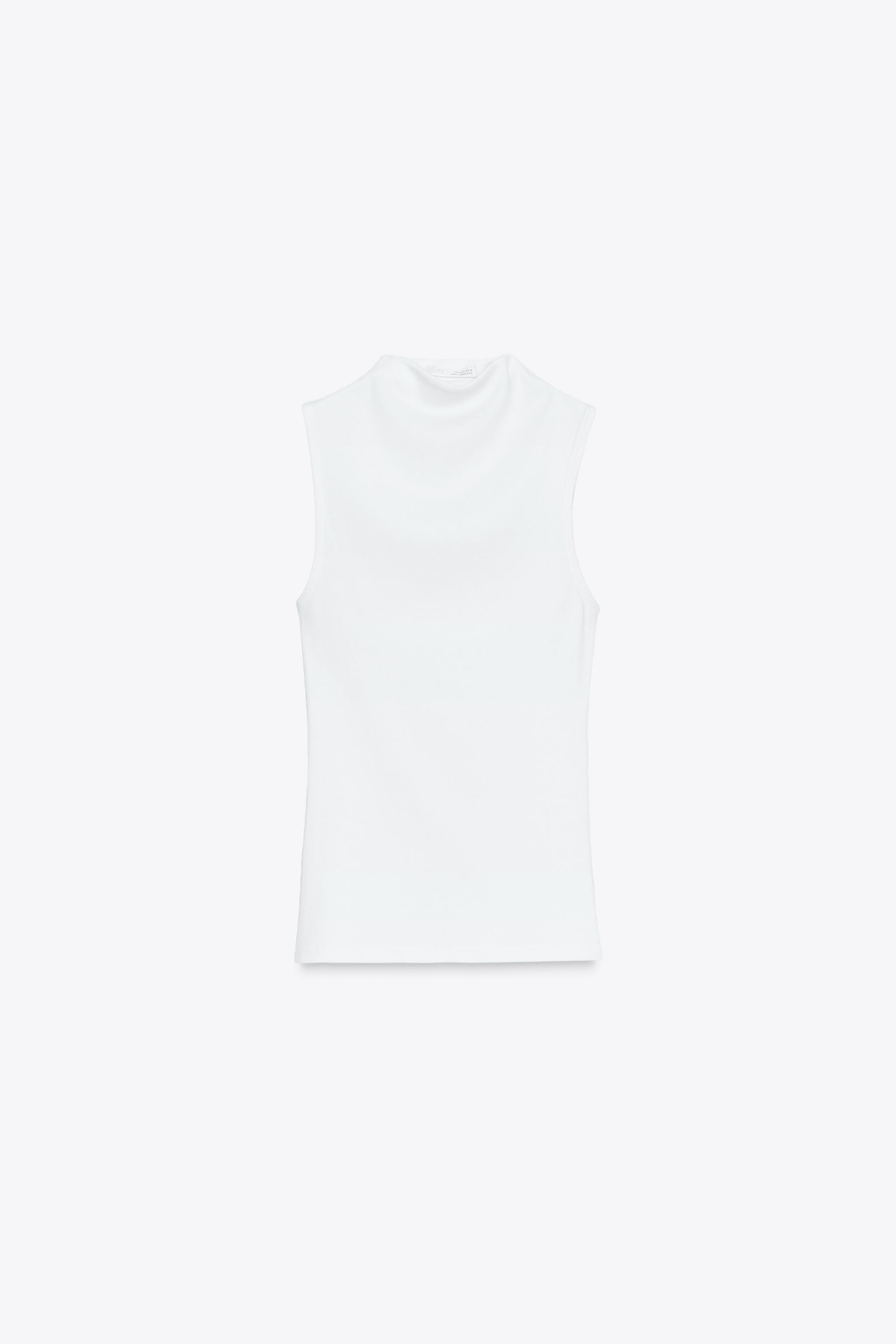Top made from cotton yarn. Mock neck and sleeveless. Straight hem. | Zara US