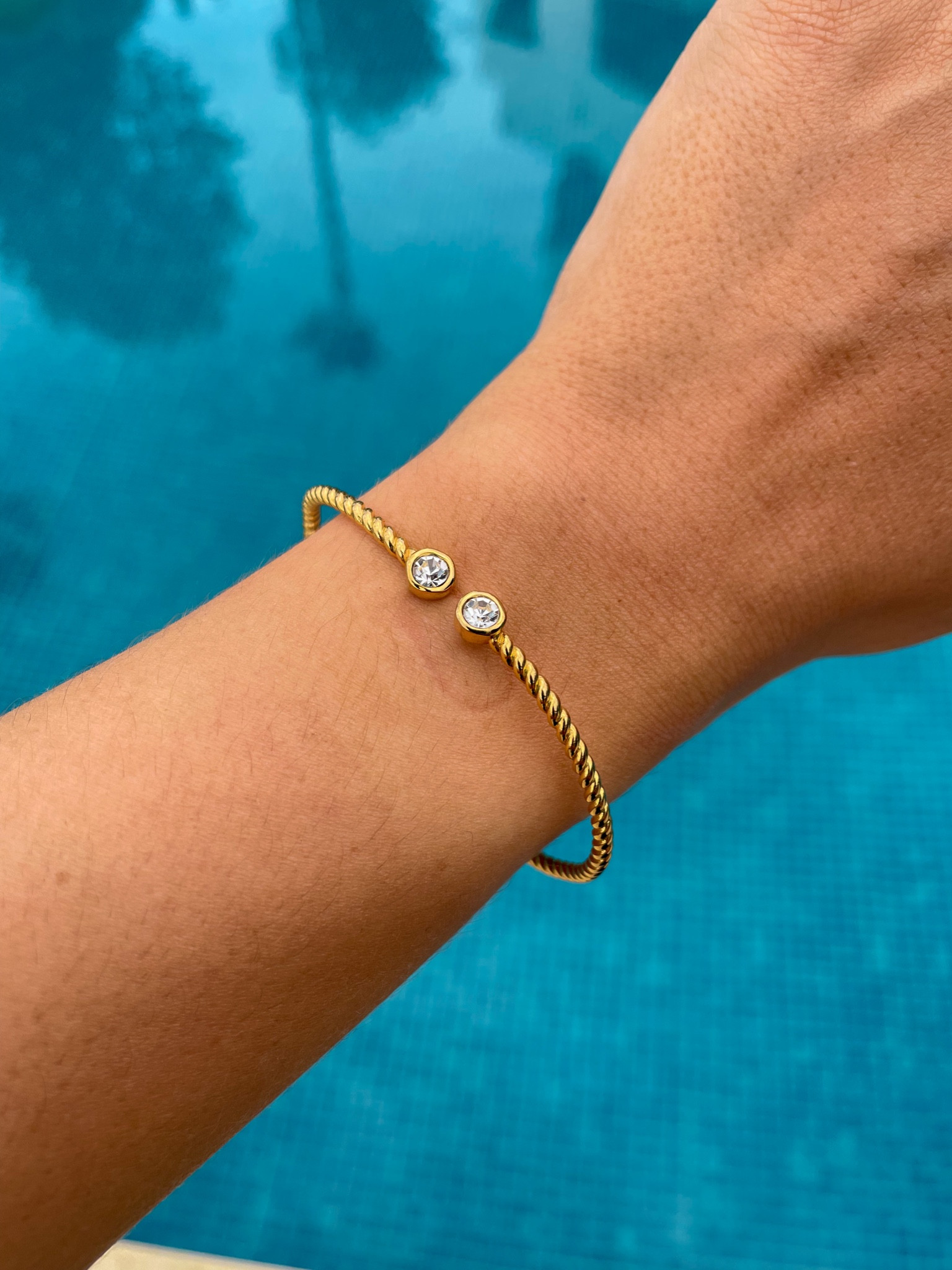 Beautiful wrap around bangle with cubic zirconia stones. Perfect on its own or stacked up with other bracelets! ✨

#LTKGiftGuide #LTKSeasonal #LTKstyletip