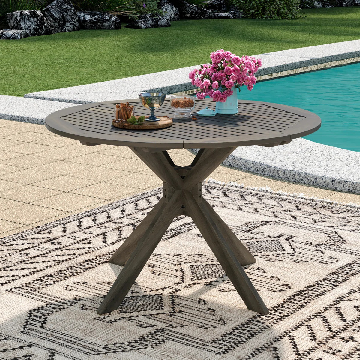 Renaud 47.25" W Solid Acacia Wood Round Outdoor Dining Table | Wayfair North America