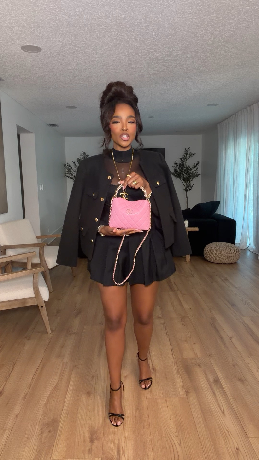 Hi babes!

This all-black look is that instant confidence outfit 🖤 The structured corset + pleated mini combo gives such a flattering shape, and layering the jacket on top makes it feel elevated and put together.

Added the pink mini bag for that pop of color — it completely transforms the look and makes it feel fun and feminine instead of just classic black.

Where to wear this:
• Date night or birthday dinner  
• Girls night out  
• Events or parties  

Undergarments: strapless bra or built-in support with seamless thong for a smooth finish.

Everything is linked below  

xx Kira | IG: KirasFashionFinds  

34D - 27 - 40 · Size Small / 4