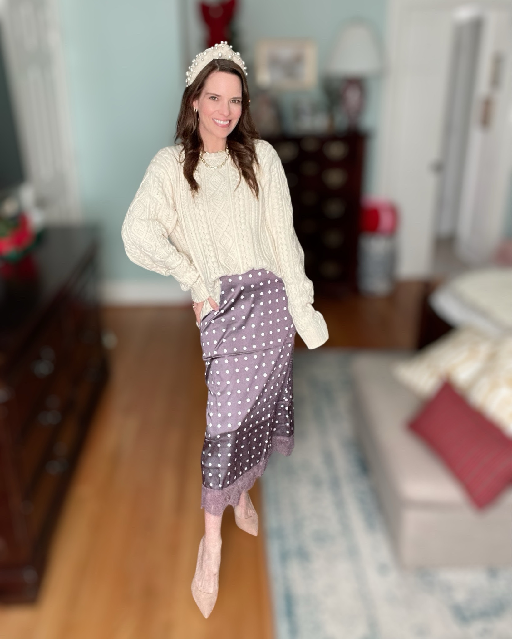 Cream Cable Knit & Polka Dot Satin Skirt Outfit 🤍✨

This is such a chic mix of cozy and feminine — a classic cream cable knit paired with a silky polka dot satin maxi skirt always feels timeless but still fun 🤍 I love how the texture of the sweater balances the softness and movement of the skirt, making this look perfect for dressing up without feeling overdone. Neutral pointed-toe heels keep everything streamlined and polished, while still feeling elegant and wearable.

I finished the look with a pearl headband for a little extra charm and layered gold jewelry to elevate the outfit. The pearl and chain necklaces add that polished, classic touch that works beautifully for holiday dinners, church, date nights, or winter events. This is one of those outfits that feels put-together but still comfortable — an easy win when you want to look chic with minimal effort ✨

Cream sweater outfit, cable knit sweater look, satin polka dot skirt outfit, winter skirt outfit, pearl headband style, neutral heel outfit, feminine winter fashion, chic holiday outfit, cozy elegant look, polished everyday outfit

#LTKFindsUnder50 #LTKHoliday #LTKWorkwear