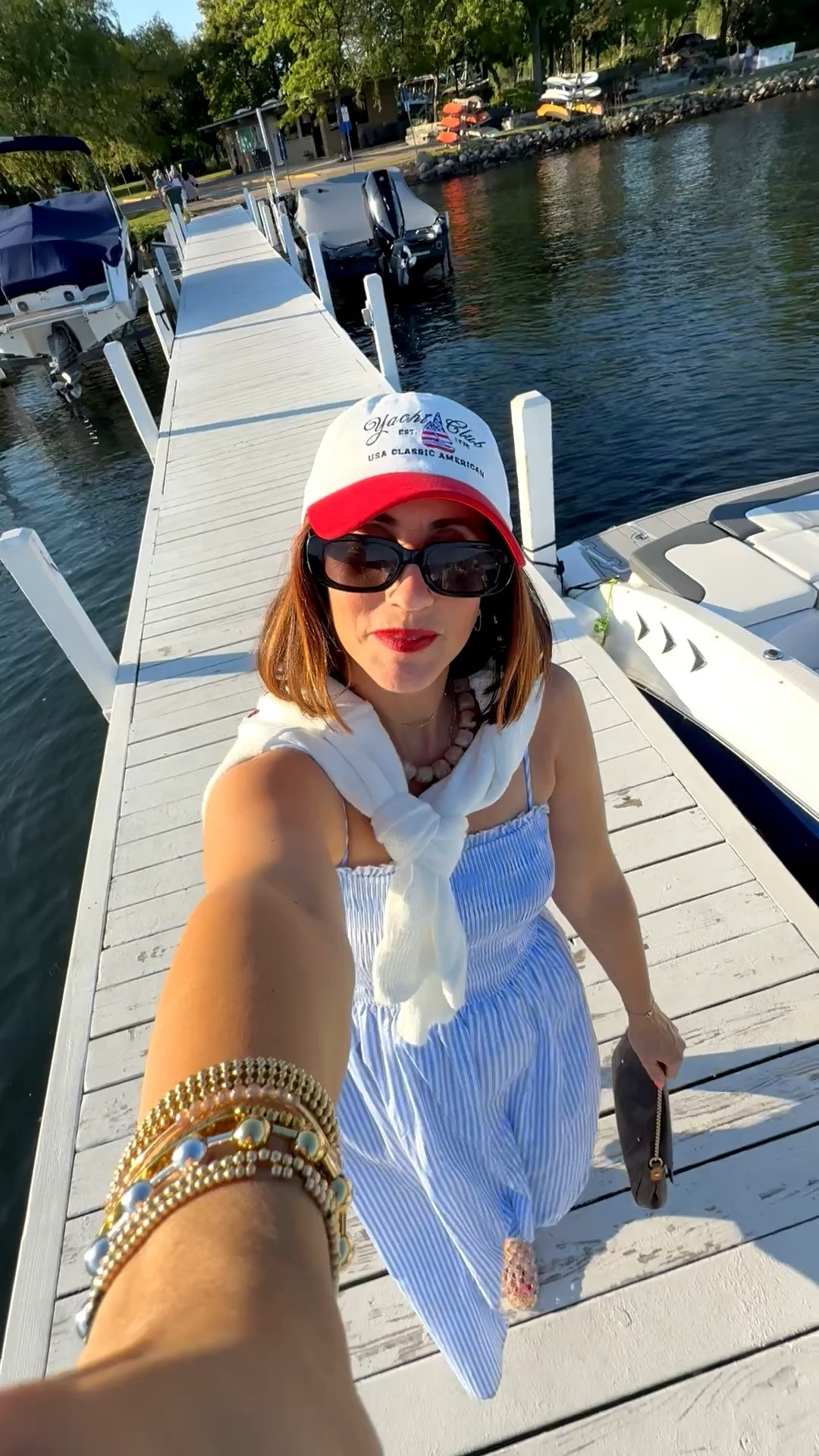 Easy patriotic outfit to copy for one more day, Fourth of July, or Labor Day! ✨Red, white & blue outfit idea! 🇺🇸 MDW boating outfit!  

• blue & white striped dress - size small 💙
• flag sweater - size medium 
• jelly flats - size 8
• USA yacht club hat🧢 

#americana #patrioticoutfit #patrioticstyle #patriotic

#LTKootd #LTKSwim #LTKTravel