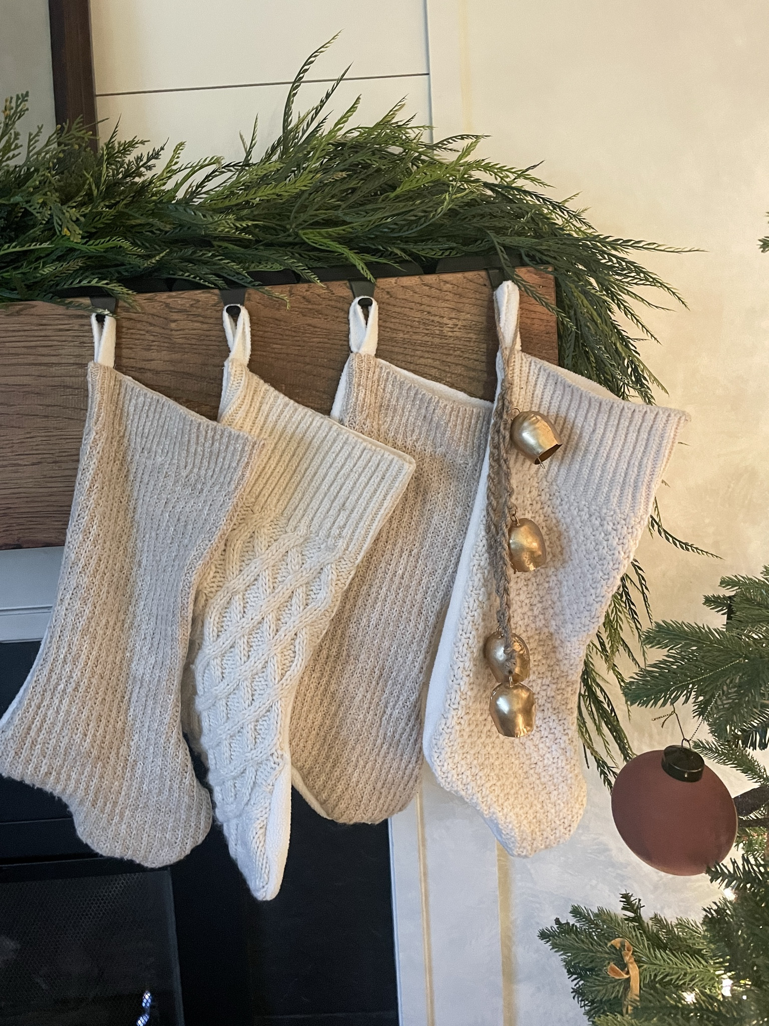 Gorgeous cable knit sweaters bring warmth and texture to your fireplace mantel.  

Christmas stockings.  Bells.  Garland.  Christmas decorations.  

#LTKHoliday #LTKSeasonal #LTKHome