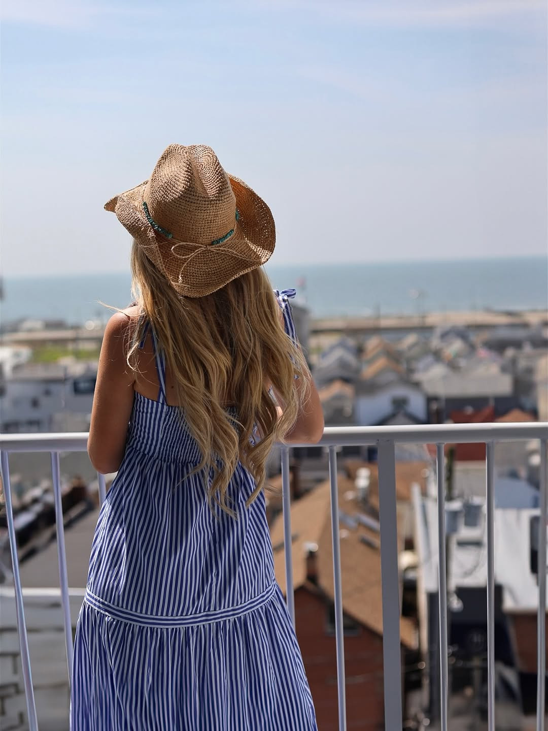Ocean air and salty hair. This breezy summer look features a blue and white striped tiered maxi dress paired with a woven straw cowboy hat featuring turquoise bead details. #CoastalGrandmother #SummerStyle #LTKtravel 

 #LTKdayinmylife #LTKgrwm #LTKootd