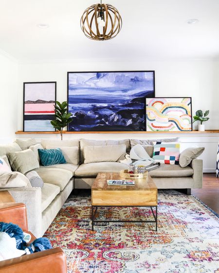 A view of our West Elm Harmony sectional sofa in our old family room! Colorful family room, colorful artwork, colorful rug, modern sofa, sectional sofa 

#LTKhome #LTKFind
