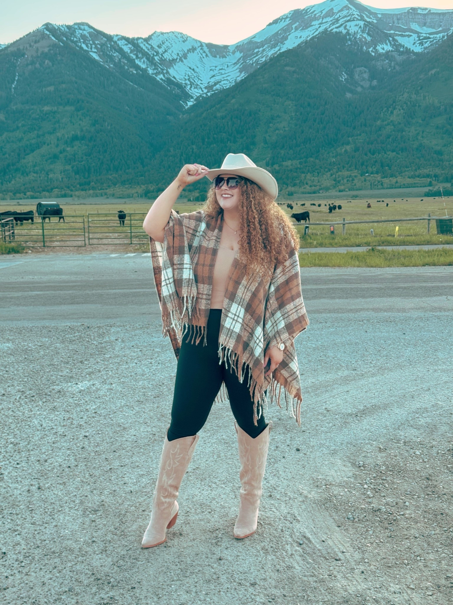 Western skies, Jackson state of mind 🏔️🤠 feeling right where I’m meant to be 🌾✨ amazon poncho | Amazon plaid poncho | amazon cardigan  | amazon plaid cardigan  | tank top | amazon tank top | amazon black leggings | amazon leggings | leggings outfit | cowgirl boots  | white cowgirl boots | amazon cowgirl boots | amazon neutral cowgirl boots | amazon finds | amazon look | amazon outfit | fall outfit | fall look | fall fashion | fall finds | fall outfit inspo | fall fashion inspo | fall 2025 | fall photos | Fall family photos | fall family photos outfit | fall vacation outfit | fall vacay | western outfit | western fashion | western outfit inspo | Jackson hole wy | Jackson hole trip | Jackson hole outfit | Yellowstone trip | cowgirl hat | amazon cowgirl hat | neutral cowgirl hat  

#LTKStyleTip #LTKMidsize #LTKSeasonal